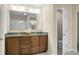 Bathroom featuring a double sink vanity with granite countertops and a separate toilet room at 212 Medford Dr, Summerville, SC 29485