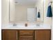 Bathroom featuring double sinks with stylish wood cabinets and large framed mirror at 212 Medford Dr, Summerville, SC 29485