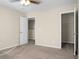 Bright bedroom featuring neutral walls, a ceiling fan, and entry to a large closet at 212 Medford Dr, Summerville, SC 29485