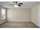 Simple bedroom with a ceiling fan, one window and tan carpet at 212 Medford Dr, Summerville, SC 29485