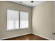 Neutral bedroom with two large windows providing lots of natural light and hardwood floors at 212 Medford Dr, Summerville, SC 29485