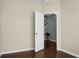 Bright bedroom with hardwood floors and an open doorway to the staircase at 212 Medford Dr, Summerville, SC 29485