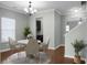 Dining room featuring modern chandelier, hardwood floors, and open access to adjacent rooms at 212 Medford Dr, Summerville, SC 29485