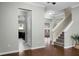 Open-concept entryway features hardwood floors, staircase, and doorways to the kitchen and living spaces at 212 Medford Dr, Summerville, SC 29485