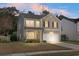 Charming two-story home featuring neutral siding, attached two-car garage, and well-manicured lawn at 212 Medford Dr, Summerville, SC 29485