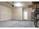 Unfinished two car garage with overhead door and single entry door at 212 Medford Dr, Summerville, SC 29485