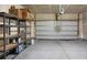 Spacious garage with shelving units and a closed overhead door at 212 Medford Dr, Summerville, SC 29485