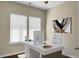 Bright home office space with two windows, modern decor, and hardwood floors at 212 Medford Dr, Summerville, SC 29485