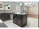 Spacious kitchen features a center island with bar stool seating, stainless steel appliances, and a window view at 212 Medford Dr, Summerville, SC 29485