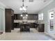 Modern kitchen boasts an island with barstools, stainless steel appliances, and plenty of cabinet space at 212 Medford Dr, Summerville, SC 29485