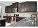 Gourmet kitchen with granite counters, stainless steel appliances, and dark cabinets at 212 Medford Dr, Summerville, SC 29485