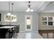 Bright kitchen includes an island with barstools and an outdoor view at 212 Medford Dr, Summerville, SC 29485