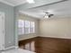 Bright living room with large windows and a modern ceiling fan at 212 Medford Dr, Summerville, SC 29485