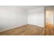 Bright bedroom featuring hardwood floors, fresh white paint and trim, and closet at 2135 Landfall Way, Seabrook Island, SC 29455