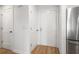 Bright entryway featuring white doors, fresh paint, and modern hardwood floors at 2135 Landfall Way, Seabrook Island, SC 29455