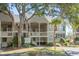 Charming two-story condo featuring a private balcony, lush landscaping and inviting curb appeal at 2135 Landfall Way, Seabrook Island, SC 29455