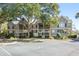 Well-maintained condo featuring a private balcony, mature trees, and convenient parking at 2135 Landfall Way, Seabrook Island, SC 29455