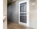 Close-up of a front door on a wooden porch with unit number and exterior lighting at 2135 Landfall Way, Seabrook Island, SC 29455