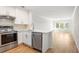 Well-lit kitchen featuring stainless steel appliances and an open floorplan to the living area at 2135 Landfall Way, Seabrook Island, SC 29455