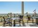 Charming outdoor patio with seating and scenic ocean view to enjoy the fresh breeze and beautiful landscape at 2135 Landfall Way, Seabrook Island, SC 29455