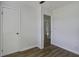 Bright bedroom featuring wood floors, clean design and convenient closet with neutral paint at 2218 Dover St, North Charleston, SC 29405