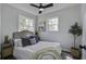 Bright bedroom featuring a neutral color palette, stylish decor, and abundant natural light from two windows at 2218 Dover St, North Charleston, SC 29405