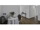 Dining area with table set for two near an open hallway at 2218 Dover St, North Charleston, SC 29405