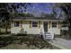 Charming home featuring a well-maintained front yard, new stairs, and a welcoming entrance at 2218 Dover St, North Charleston, SC 29405