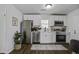 Bright kitchen with stainless steel appliances, white cabinetry and modern finishes at 2218 Dover St, North Charleston, SC 29405