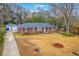 Charming brick home with detached garage and driveway, as seen from above at 2410 Trent St, Charleston, SC 29414