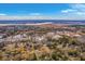 Expansive aerial view of a charming neighborhood near the coast, under a bright blue sky with scattered clouds at 2410 Trent St, Charleston, SC 29414
