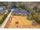 Bird's eye view of a brick home with a driveway and surrounding neighborhood at 2410 Trent St, Charleston, SC 29414