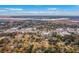 An expansive overhead shot captures a mix of residential and commercial properties within a waterside town at 2410 Trent St, Charleston, SC 29414