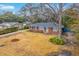 Aerial view of a lovely brick home with a large yard and mature trees at 2410 Trent St, Charleston, SC 29414