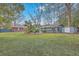 Large landscaped backyard with a variety of trees and foliage, great for outdoor activities at 2410 Trent St, Charleston, SC 29414