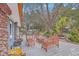 Inviting backyard patio area with wooden benches, outdoor lighting, and a BBQ pit at 2410 Trent St, Charleston, SC 29414