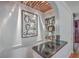 Unique bar area with wine glass storage, decor, and view into the kitchen at 2410 Trent St, Charleston, SC 29414