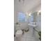 Cozy bathroom features white pedestal sink, toilet, and classic tiled floor at 2410 Trent St, Charleston, SC 29414