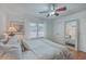 Bright bedroom with hardwood floors, ceiling fan, window and large mirror at 2410 Trent St, Charleston, SC 29414