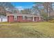 Charming brick home with a well-manicured lawn and classic architectural details at 2410 Trent St, Charleston, SC 29414