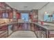 Elegant kitchen featuring dark wood cabinetry, granite countertops, and modern appliances for a sophisticated look at 2410 Trent St, Charleston, SC 29414