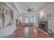 Bright living room with hardwood floors, fireplace, tray ceiling, and neutral decor at 2410 Trent St, Charleston, SC 29414