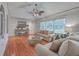 Comfortable living room with hardwood floors, stylish furnishings, and ample natural light through large windows at 2410 Trent St, Charleston, SC 29414