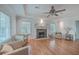 Spacious living room with hardwood floors, fireplace, tray ceiling, and neutral decor at 2410 Trent St, Charleston, SC 29414