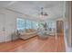 Spacious living room featuring hardwood floors, large windows, and comfortable seating, perfect for relaxation at 2410 Trent St, Charleston, SC 29414