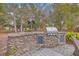 Outdoor kitchen area features a built-in grill, sink and patio space at 2410 Trent St, Charleston, SC 29414