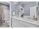 Double vanity bathroom with white cabinets, quartz countertops, and modern fixtures at 2425 Giles Ln, Mount Pleasant, SC 29466