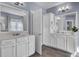 Double vanity bathroom with white cabinets, quartz counters, and a tiled floor at 2425 Giles Ln, Mount Pleasant, SC 29466