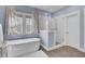 Bathroom with white cabinets, a glass enclosed shower, and stand alone tub at 2425 Giles Ln, Mount Pleasant, SC 29466