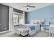 Bright bedroom featuring a ceiling fan and a comfortable queen bed, ideal for relaxing after a long day at 2425 Giles Ln, Mount Pleasant, SC 29466